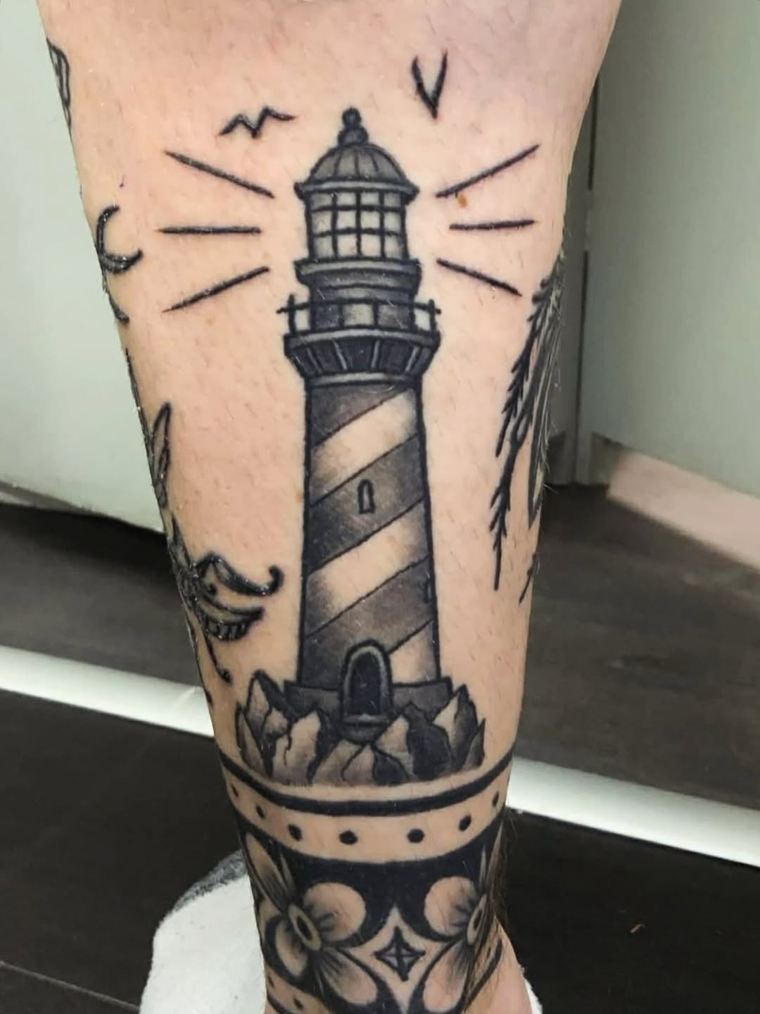 The lighthouse of the left calf. Work by Stephen. #americantraditionaltattoo #stephenkennedy #galwaybaytattoo #galwaycity #galwaybaytattooartists